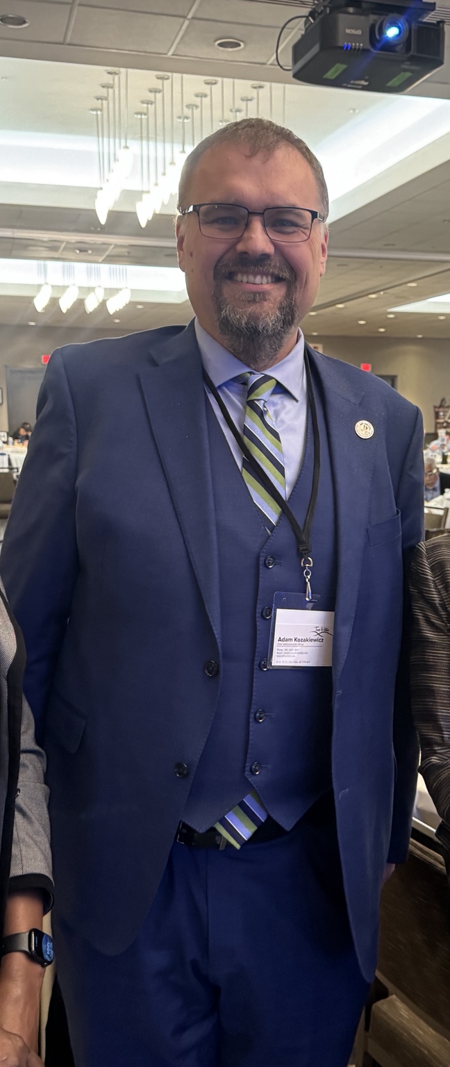 Adam Kozakiewicz at a professional event.